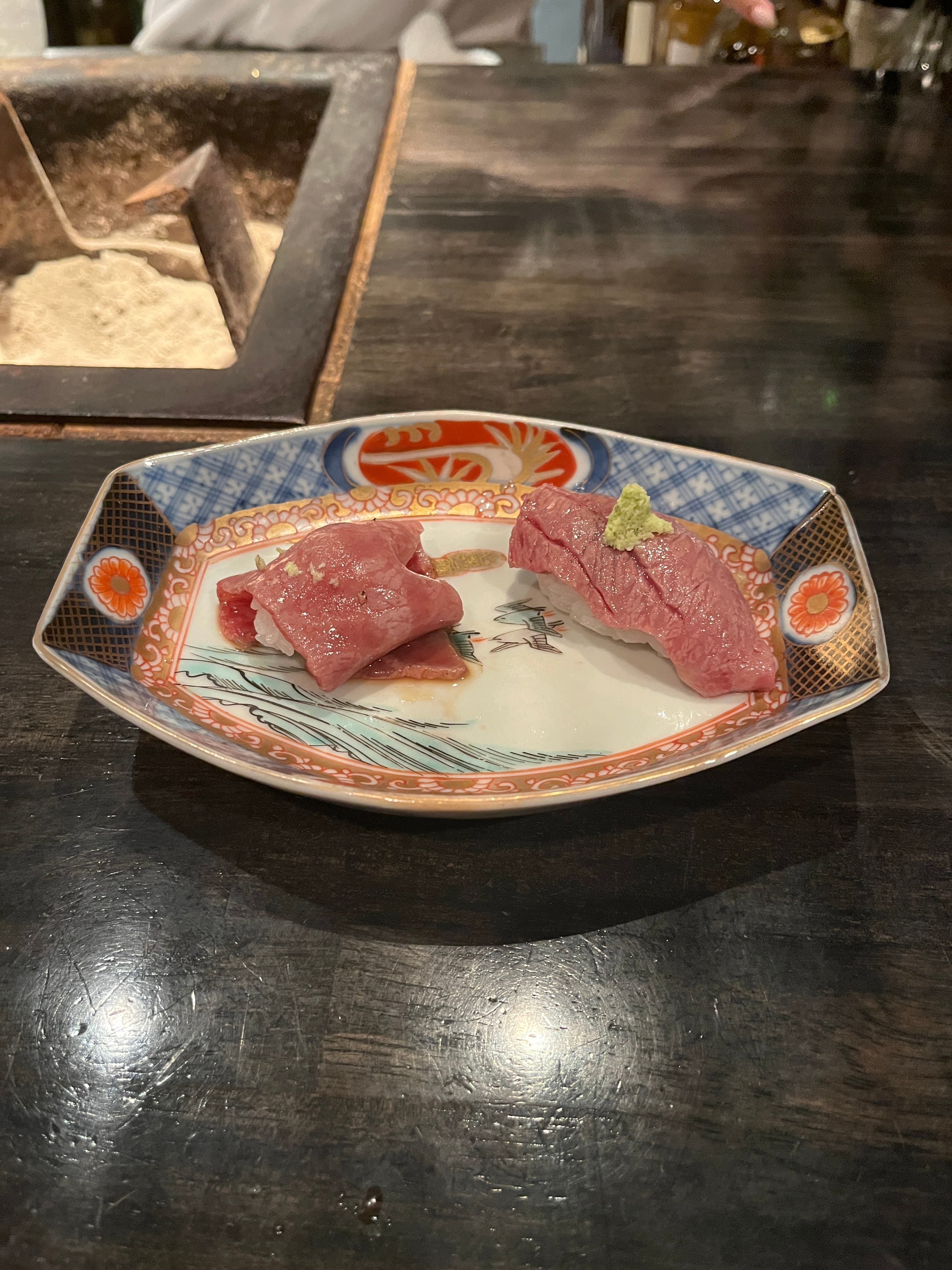 Beef nigiri, one sesame teriyaki, one wasabi